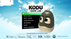 Das Bild zeigt die Benutzeroberfläche von Kodu. Es wird das Menü mit den Punkten "Weiter", "Neue Welt", "Welt laden", "Gemeinschaft", "Optionen", "Hilfe" und "Kodu beenden" dargestellt. Das "Maskottchen" ist ein 3-dimensionaler, ovaler Körper ohne Arme und Beine. Es hat eine kleine Antenne auf dem Kopf und zwei große Augen.